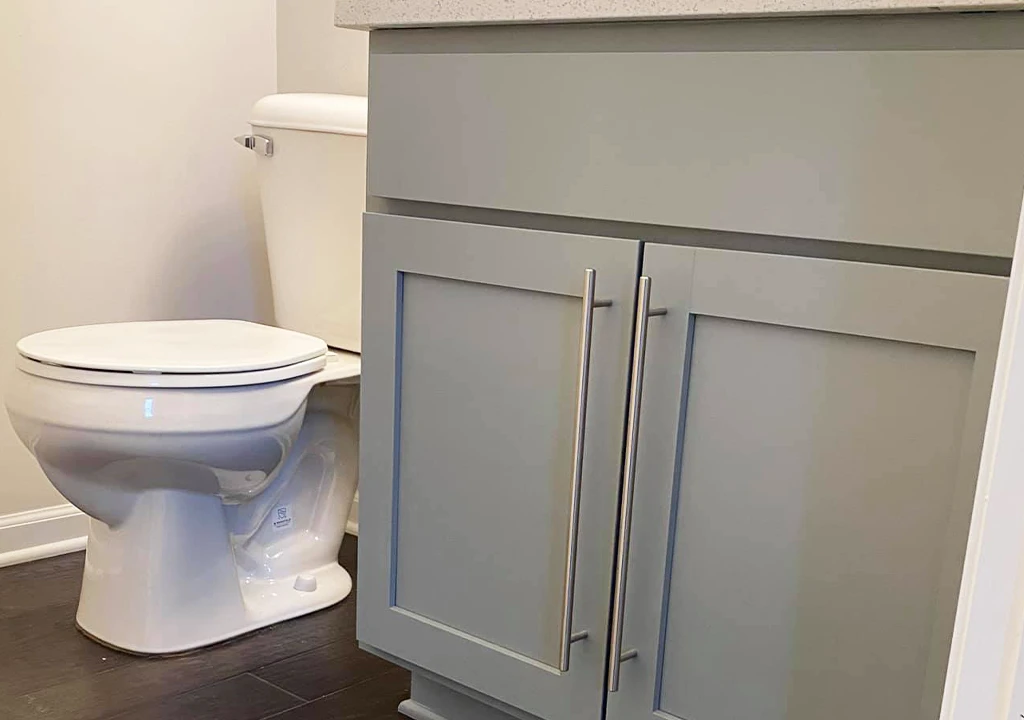 bathroom vanity cabinet refinished with grey paint