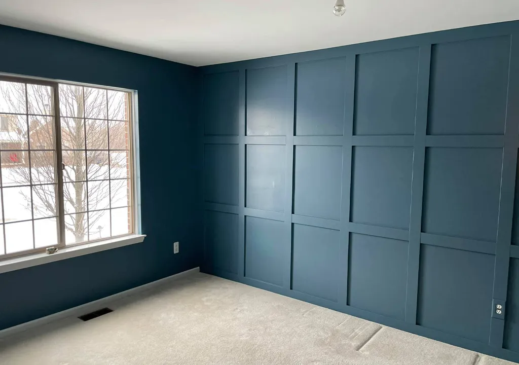 dark grey blue accent wall paint with wood texture and square design