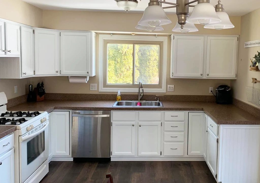 old kitchen cabinets professionally refinished with white paint